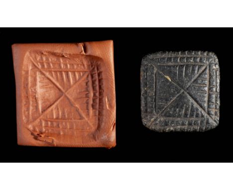 *Mesopotamian square button-type seal, prehistoric, circa 5th millennium BC,  black basalt, linear geometric, suspension loop