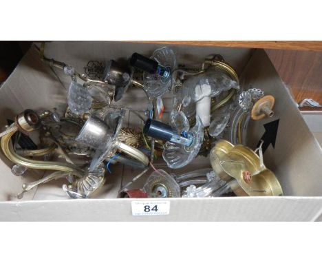 A box of glass wall light parts.