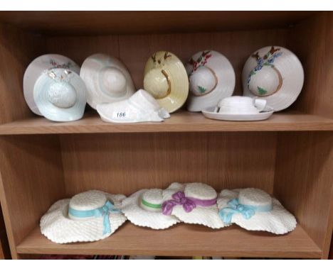 12 assorted ceramic hat wall pockets, (2 shelves).