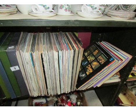 A shelf of LP records, (in excess of 100).