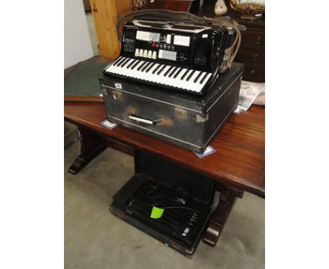 An electric hand crafted Gioletti piano accordion with bass expander unit.