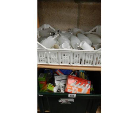 2 boxes on 2 shelves of light bulbs.