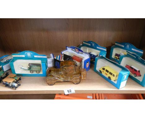 A shelf of die cast models etc.,