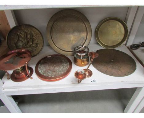 A shelf of brass and copper.