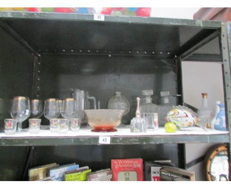 A mixed lot of glass ware, one shelf.