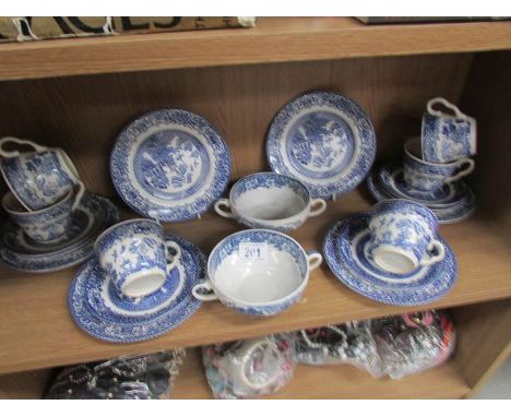 A shelf of blue and white tea ware.