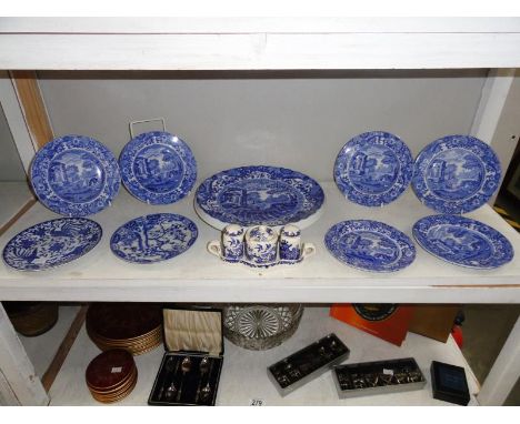 A shelf of blue and white table ware.