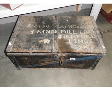 An old tin trunk marked 563140 Sgt. W. Gulliver.