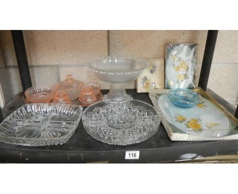 A shelf of assorted glassware.