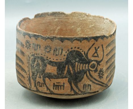 A choice Harappan jar from the Indus Valley, ca. 2500 - 1800 BC. It is 3-3/4 in in diameter, stands on a ring base and featur