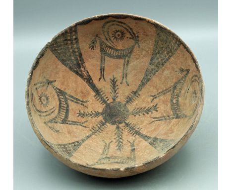 A lovely Harappan bowl from the Indus Valley, ca. 2500 - 1800 BC. It is 7-1/4 in in diameter, stands on a ring base and featu