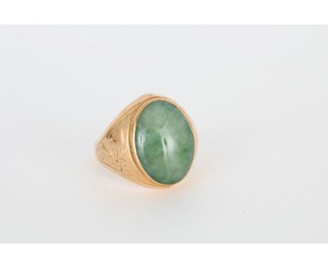 18K Gold &amp; Jade Mens Ring. Stamped inside band. Hand chased design on both sides with large center jade stone. Ring Size: