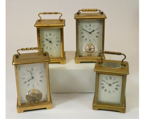 Two Schatz 8 day, brass carriage clocks, with visible escapement, together with a Bayard 8 day manual wind  clock and an unma