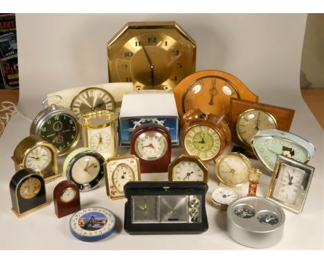 A collection of clocks to include,  a marble effect Westclox mantel clock, a Timemaster quartz wall clock, an Elvis Presley a