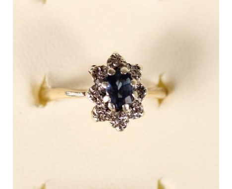 A 9ct gold blue and white stone cluster ring, 2.8gm, K 