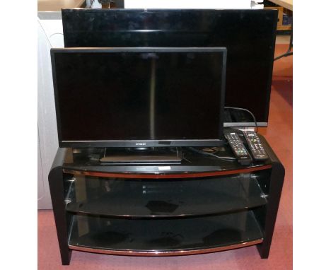 A Panasonic 32 inch LCD TV, model TX 32 C5510B together with a Linsar 24 inch LCD TV model ED 1700, a TV/Hi-Fi stand and remo
