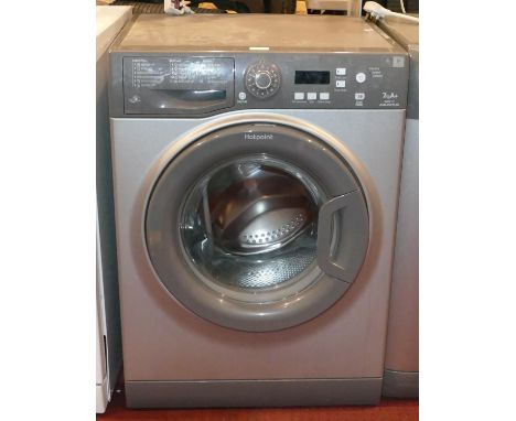 A Hotpoint Aquarius washing machine in silver, model WMAQF 721 7K A+ 59cm wide, 51cm deep.