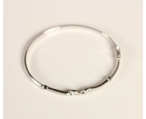 A 9k white gold and CZ bangle, 4gm 