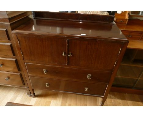 An early 20th century sideboard, hinged doors over two long drawers, H-117cm, W-106cm, D-47cm, together with mahogany trunk w