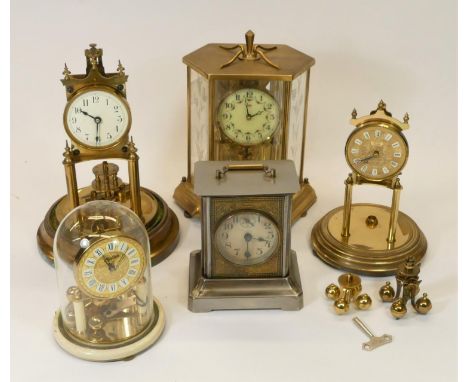 A collection of clocks to include, manual wind anniversary clocks and a manual wind mantel clock 