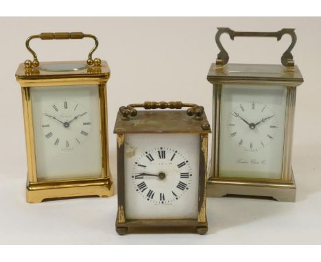 An Extence manual wind carriage clock, a London Clock Co. manual wind carriage clock, together with a smaller brass clock (3)