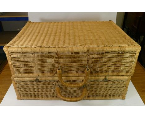 A large wicker traveling trunk together with a pair of wooden cantilever 4 tier sewing boxes, contents to include wool, silks