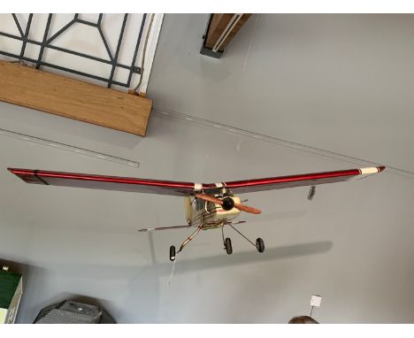 A 1970s/80s kit built model RC plane with 2 stroke engine, a spare set of wings, 140 cm wingspan, 105cm length, together with
