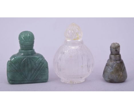 AN INDIAN ROCK CRYSTAL SCENT BOTTLE, 6.5cm, together with a small jade scent bottle, 4cm, and another jadeite scent bottle, 5
