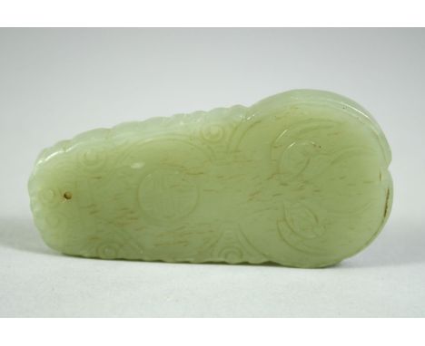 A CHINESE CELADON JADE PENDANT, decorated with auspicious characters, 2.7in high.