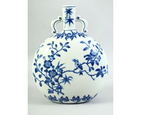 A CHINESE BLUE AND WHITE TWIN HANDLE MOON FLASK, decorated with a bird on a tree, 29cm high.