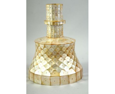 AN INDIAN GOA MOTHER OF PEARL CANDLESTICK, 25cm high.
