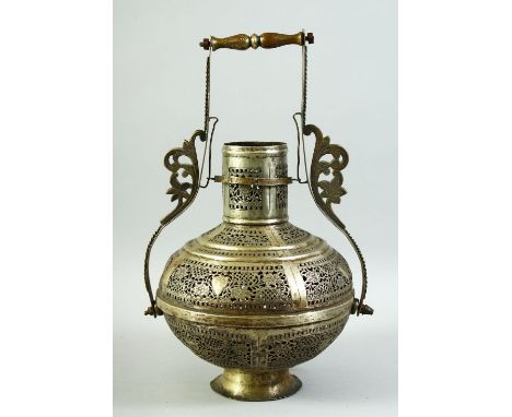 AN ISLAMIC OPENWORK METAL LANTERN / LAMP, with pierced floral decoration and handle, 38cm high overall.
