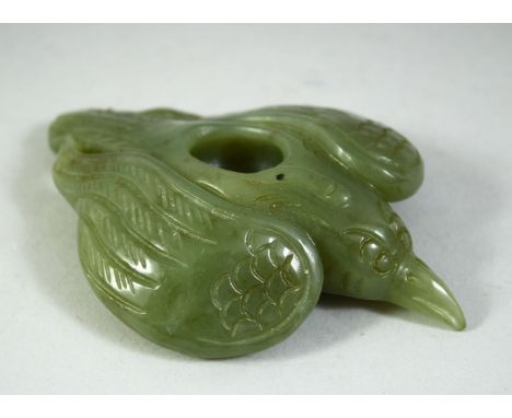 A CARVED JADE MODEL OF A BIRD, 11cm long.