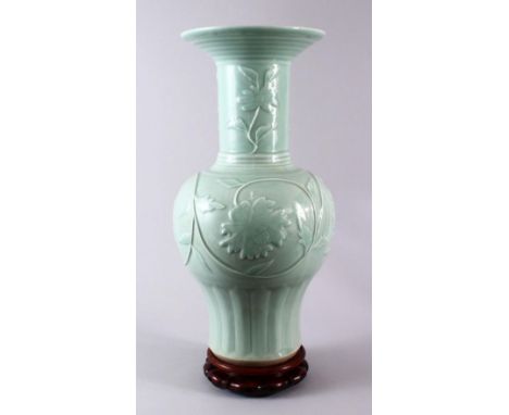 A LARGE CHINESE CELADON PORCELAIN VASE &amp; STAND, the vase decorated with moulded floral decoration, four character mark to