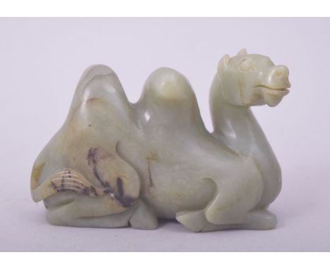 A CARVED JADE MODEL OF A CAMEL, 9cm long.
