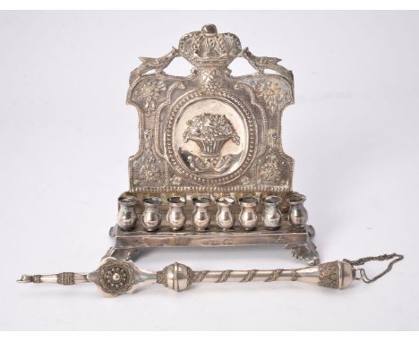 [Judaica] A Polish (Russian Empire) silver Hanukah lamp, Warsaw 1892, the backplate chased with two peacocks centring a crown