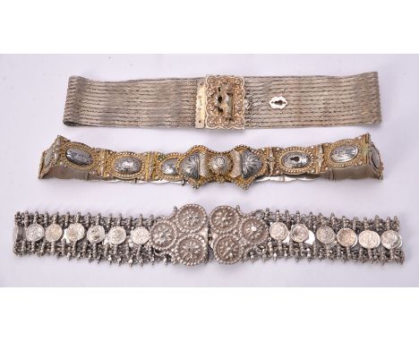 Three Ottoman or Egyptian silver belts, comprising: one woven silver, Tughra and sah marks, pre 1922, the shaped rectangular 