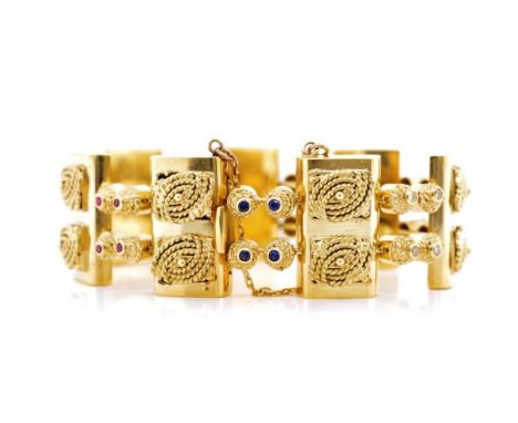 18ct yellow gold and multi gemstone bracelet set with diamonds, rubies, sapphire and emeralds. Approx rectangular panel size 