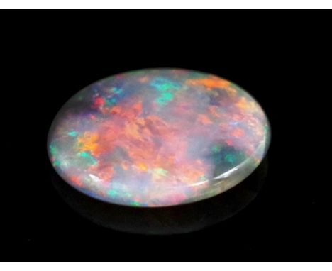 Loose black opal (16mm x 13mm) showing strong red, flashes of blue green and oranges. Black inclusion to outer edge. Approx 1