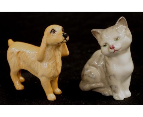 Beswick ceramic Dog figure marked to base, (height 8cm approx); together with a Royal Doulton Seated Cat figure, marked to ba