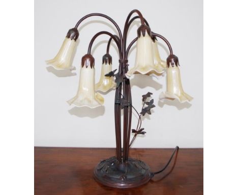 Art Nouveau style electric table lamp with cast metal in relief dragon flies to base, holding 6 six stems branching into six 