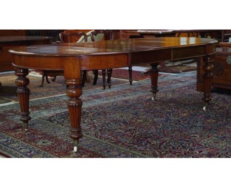 Victorian extension table with reeded legs. Two leaf extensions, 52cm wide each. Total length 222cm, 120cm wide and 77cm tall