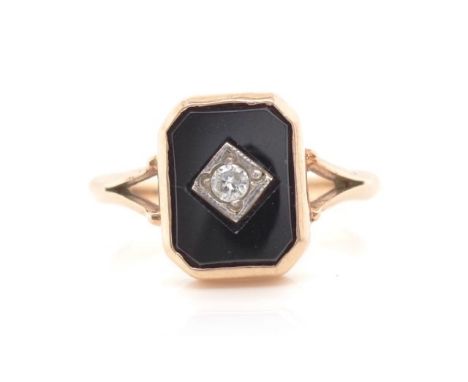 Diamond, onyx and 9ct rose gold ring marked 9. Approx weight 2.6 grams, panel size 9x7mm, ring size M-N