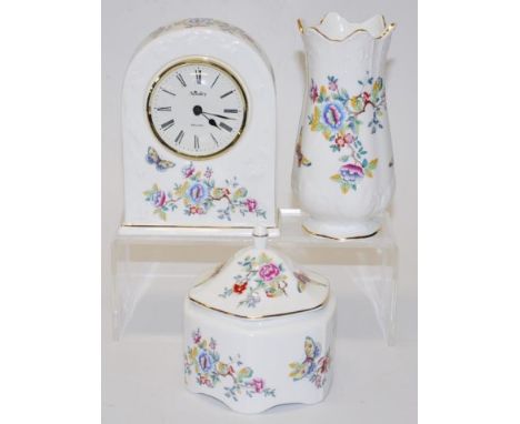 Three Aynsley 'Butterflies' ceramic table pieces comprising clock, trinket box &amp; vase, tallest 16cm approx.