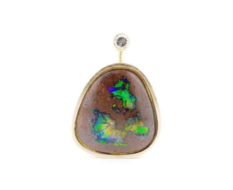 Boulder opal and yellow gold pendant also set with a single cut diamond. Approx weight 3.4 grams, width 13mm. tests as 14ct