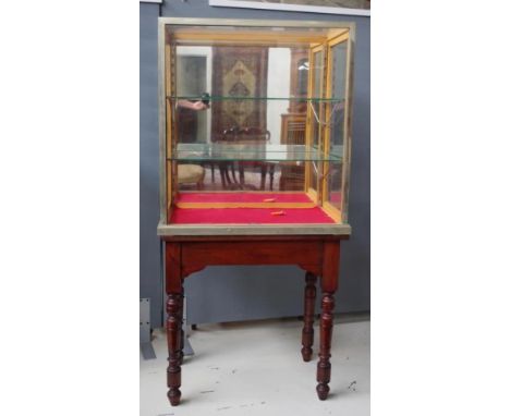 Early 20th century shop display cabinet with side opening doors and glass shelves, 76cm wide,  45cm deep, 84cm high, together