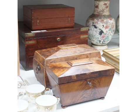 A Victorian boxwood strung burr yew sarcophagus shaped tea caddy, another mahogany tea caddy, a brass bound mahogany silver b