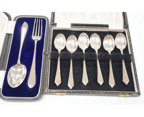 A cased set of six modern silver teaspoons and a cased silver Christening spoon &amp; fork, 4.5oz.