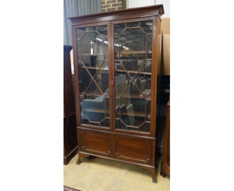 A 1920's Chippendale revival mahogany bookcase, length 115cm, depth 34cm, height 202cm