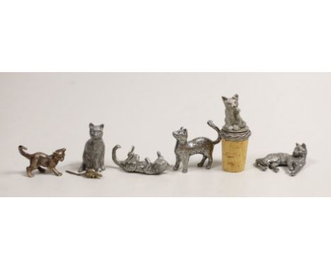 A modern silver miniature free standing model of a cat, with raised paw, London, 1995, length 37mm, together with four other 